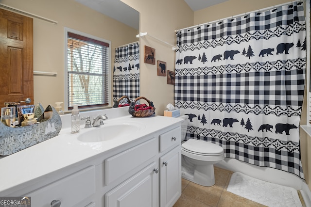 bathroom with tile patterned floors, toilet, and vanity