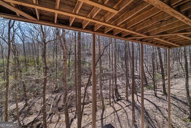 exterior space featuring a view of trees