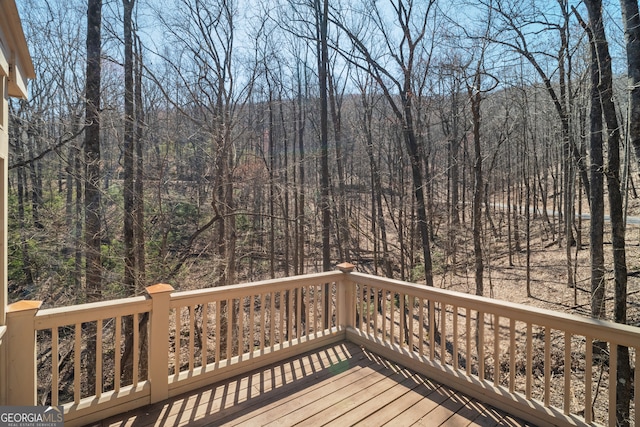 deck featuring a forest view