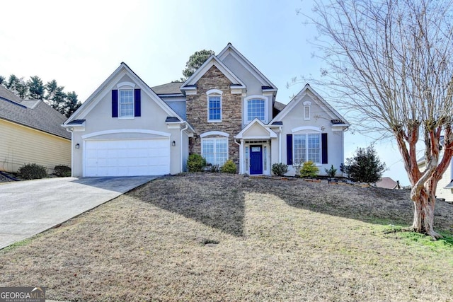 traditional-style home featuring driveway, an attached garage, stucco siding, a front lawn, and stone siding