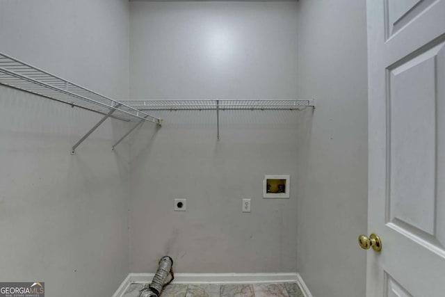 clothes washing area featuring washer hookup, laundry area, baseboards, and hookup for an electric dryer