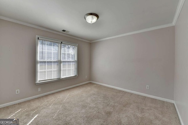 carpeted empty room featuring visible vents, baseboards, and ornamental molding