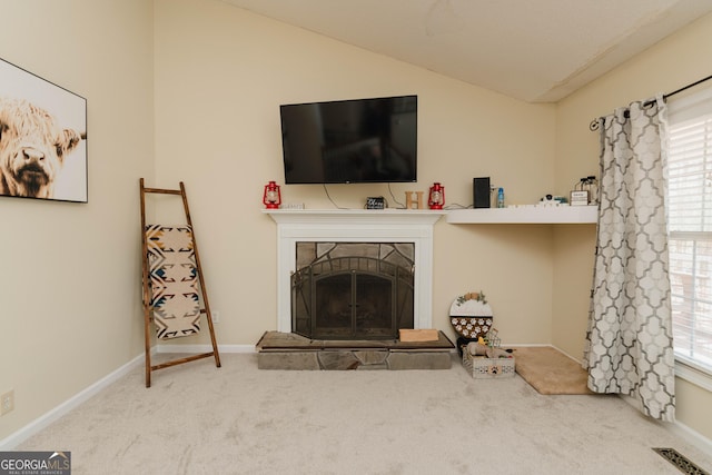 31 Wyngate Ct, Dallas, GA 30157 - living room featuring vaulted ceiling, carpet floors, a fireplace with raised hearth, baseboards, and visible vents