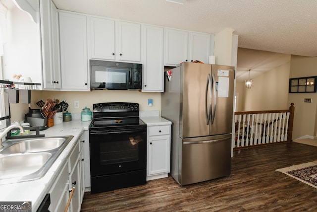 kitchen with white cabinetry, black appliances, dark wood-type flooring, and a sink