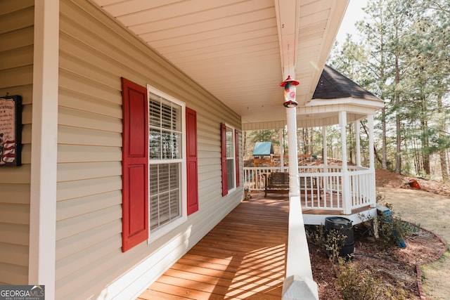 wooden terrace with a porch