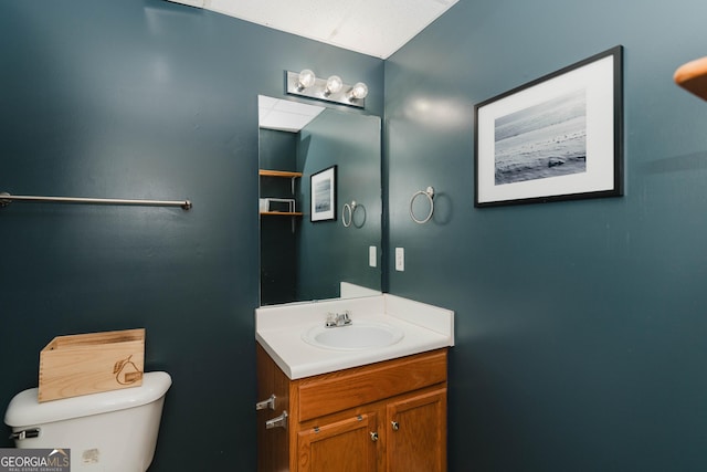 bathroom with toilet and vanity