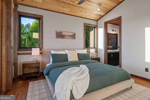 bedroom with connected bathroom, lofted ceiling, wood ceiling, and wood finished floors