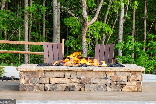 exterior details with an outdoor fire pit