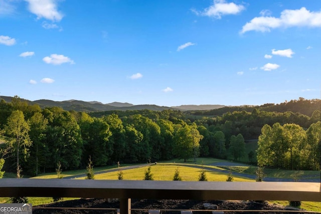 mountain view featuring a wooded view