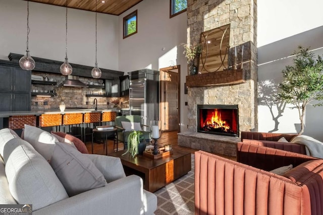 living room with wood finished floors and a fireplace