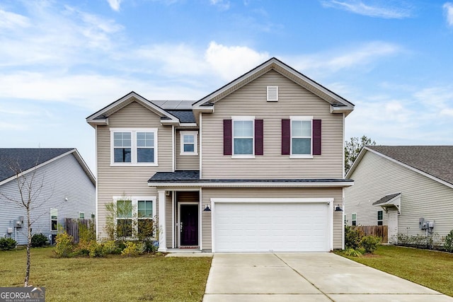 traditional home featuring fence, driveway, solar panels, an attached garage, and a front lawn