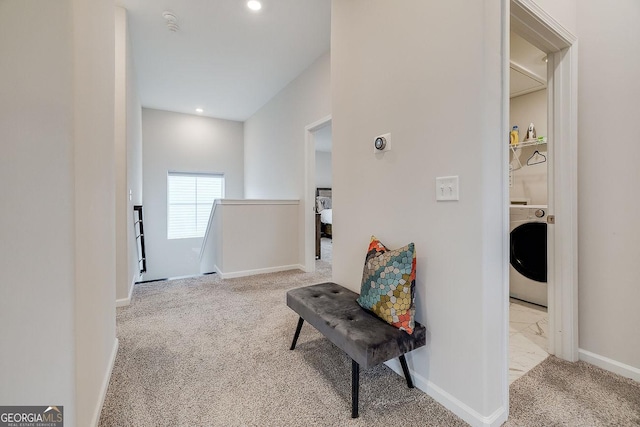 hallway featuring carpet, baseboards, washer / dryer, recessed lighting, and an upstairs landing