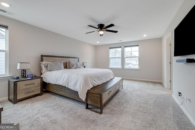 bedroom featuring visible vents, baseboards, light colored carpet, recessed lighting, and a ceiling fan