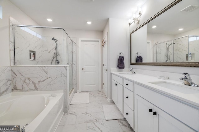 full bathroom featuring a sink, visible vents, marble finish floor, and a bath