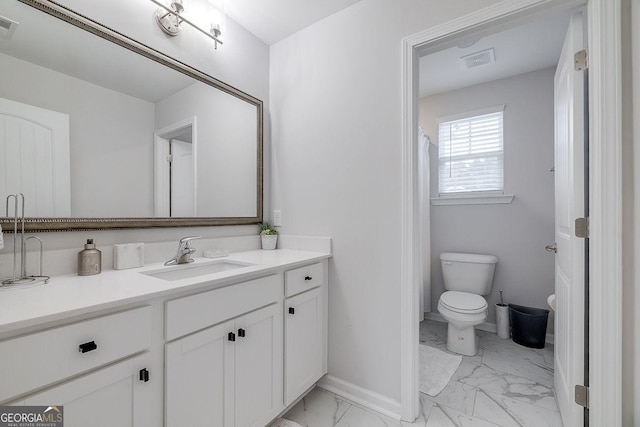 bathroom featuring visible vents, toilet, marble finish floor, and vanity