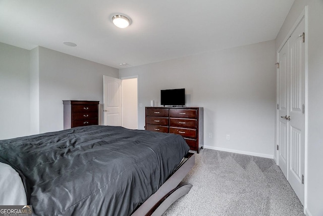 carpeted bedroom featuring baseboards