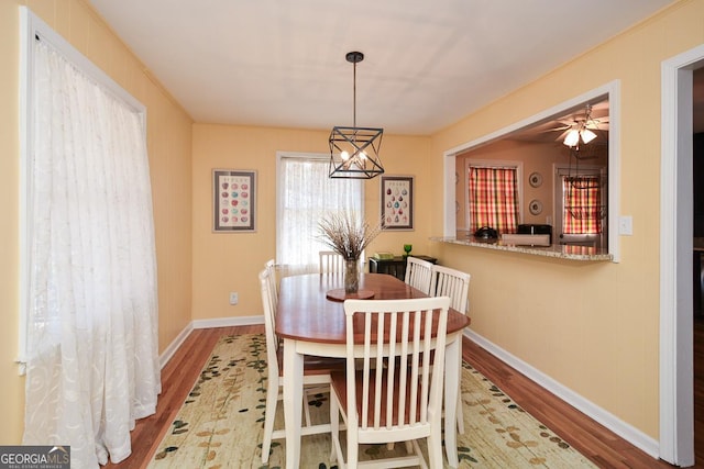 2780 Eastfield Rd SE, Smyrna, GA 30080 - dining space with baseboards, wood finished floors, and ceiling fan