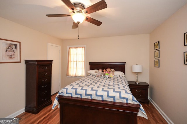 bedroom featuring dark wood finished floors, baseboards, and ceiling fan