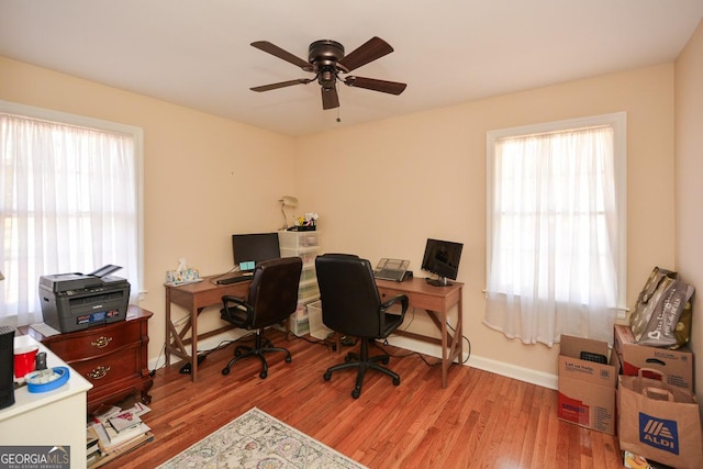 office with baseboards, plenty of natural light, and wood finished floors