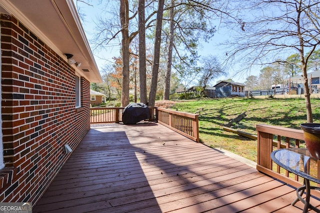 wooden deck with a yard