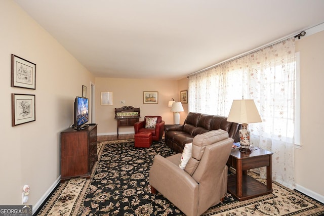 living room featuring baseboards