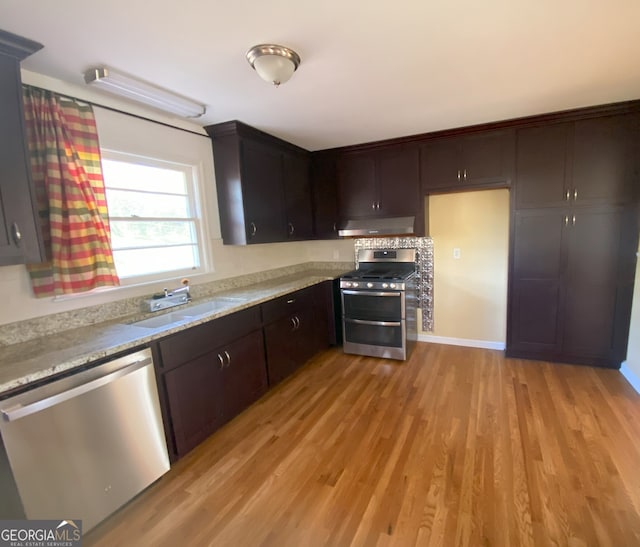2780 Eastfield Rd SE, Smyrna, GA 30080 - kitchen with a sink, light wood-style flooring, under cabinet range hood, and appliances with stainless steel finishes