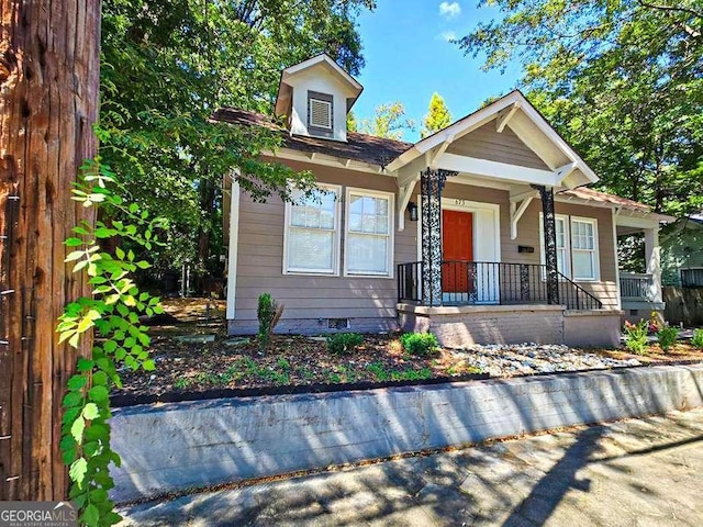 bungalow-style home featuring crawl space and covered porch