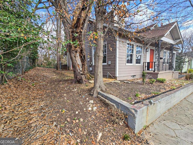 view of side of home with crawl space