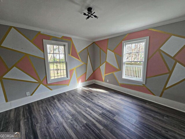 interior space with baseboards and wood finished floors