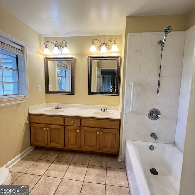 bathroom with tile patterned flooring, double vanity, shower / bath combination, and a sink