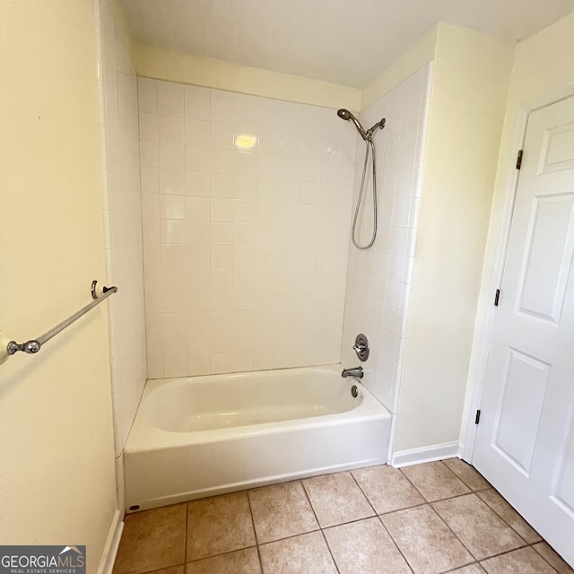 bathroom with tile patterned floors, shower / bathing tub combination, and baseboards