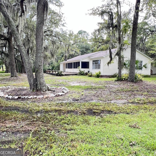 view of front of house with a sunroom