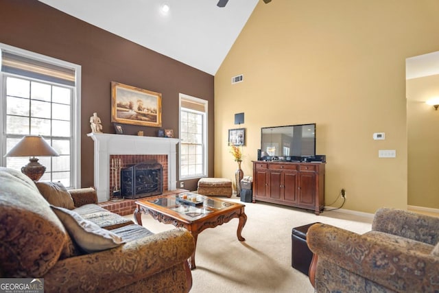 living room with visible vents, high vaulted ceiling, a fireplace, carpet flooring, and baseboards