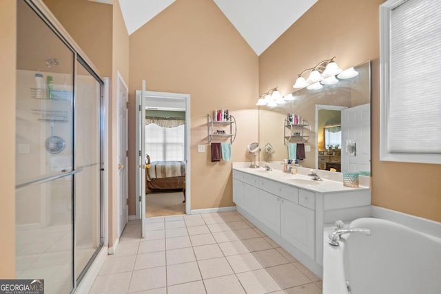 bathroom featuring lofted ceiling, a stall shower, ensuite bathroom, and tile patterned flooring