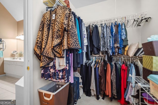 walk in closet with tile patterned flooring