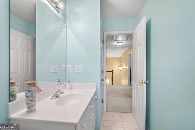 bathroom with tile patterned floors and vanity