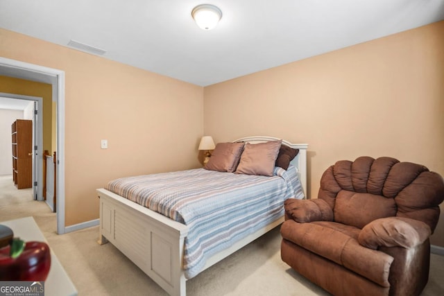 bedroom featuring visible vents, light colored carpet, and baseboards