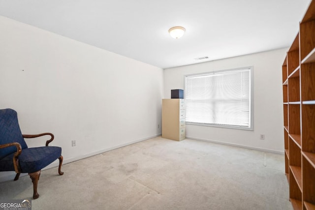 sitting room featuring visible vents, baseboards, and carpet