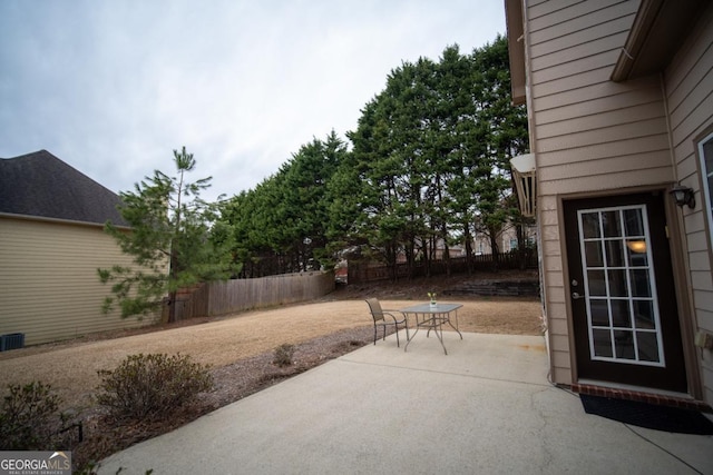 view of patio featuring fence