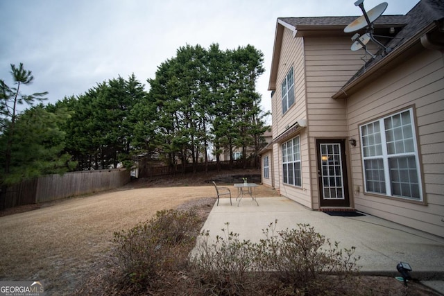 view of yard featuring a patio and fence