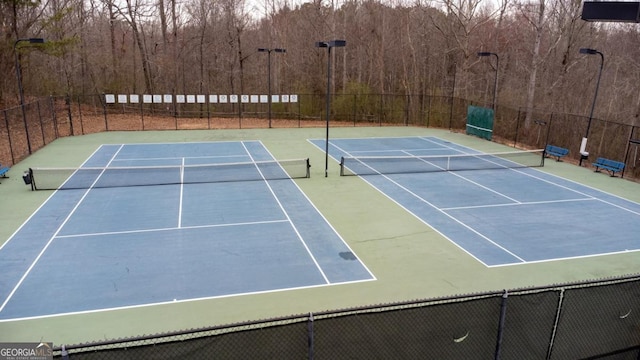 view of sport court with community basketball court and fence