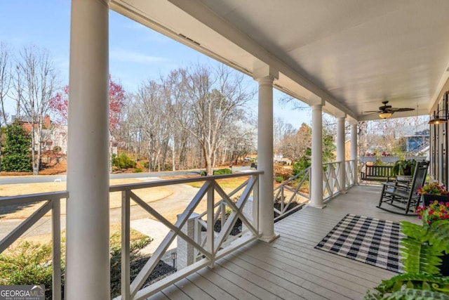 deck with covered porch and ceiling fan