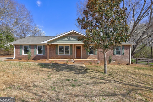 ranch-style house with crawl space, a front yard, and fence