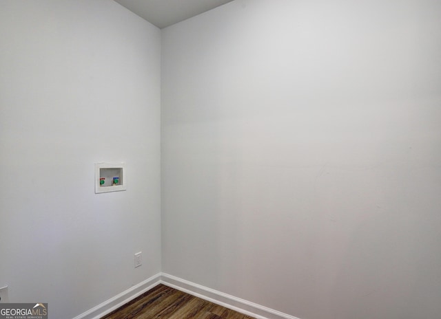 clothes washing area with laundry area, hookup for a washing machine, dark wood-style floors, and baseboards