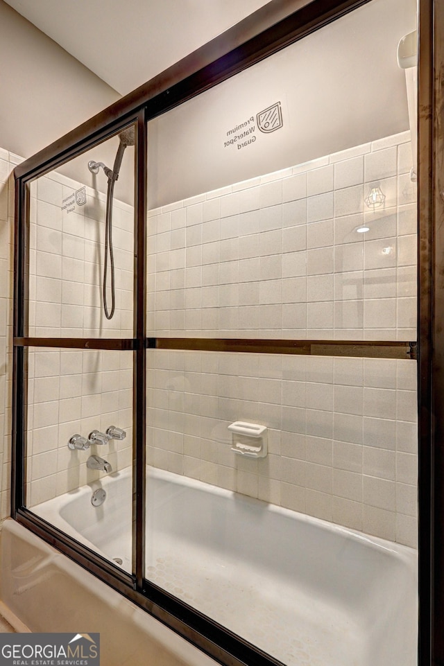 bathroom featuring enclosed tub / shower combo