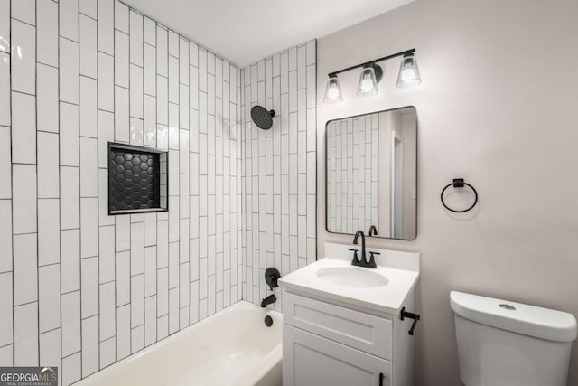 bathroom featuring vanity, bathing tub / shower combination, and toilet