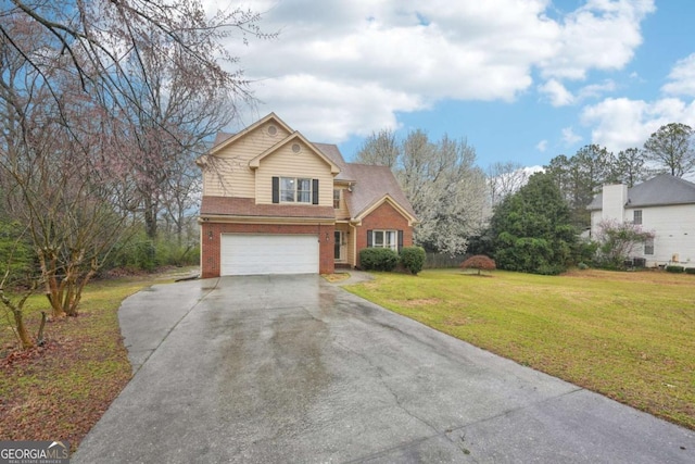 traditional-style home featuring a garage, driveway, brick siding, and a front yard