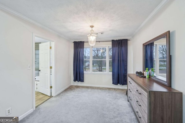 interior space featuring crown molding, visible vents, and a textured ceiling