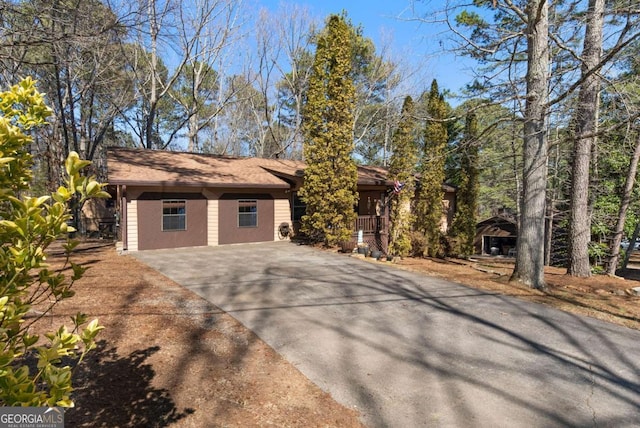 view of home's exterior featuring driveway