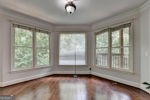 interior space featuring dark wood-type flooring and baseboards